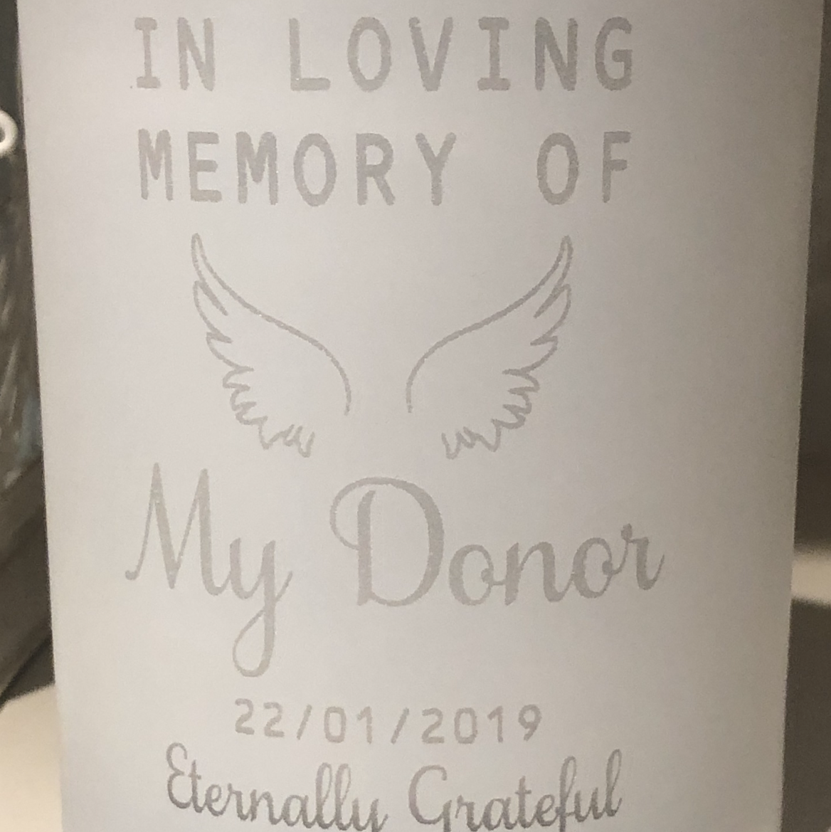 white candle jar with My Donor memorial